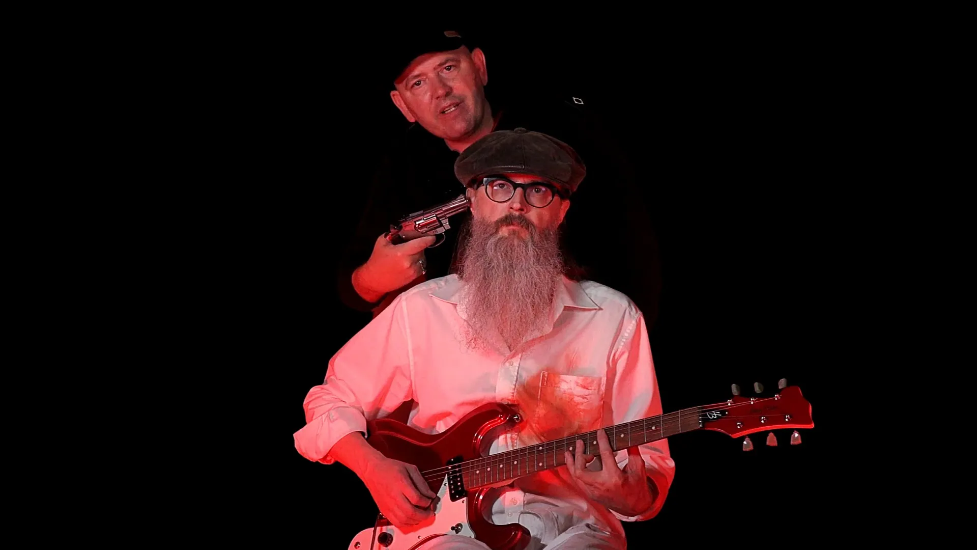 Peter Capon with guitar and Dieter Provoost behind him, from the Bang Bang video