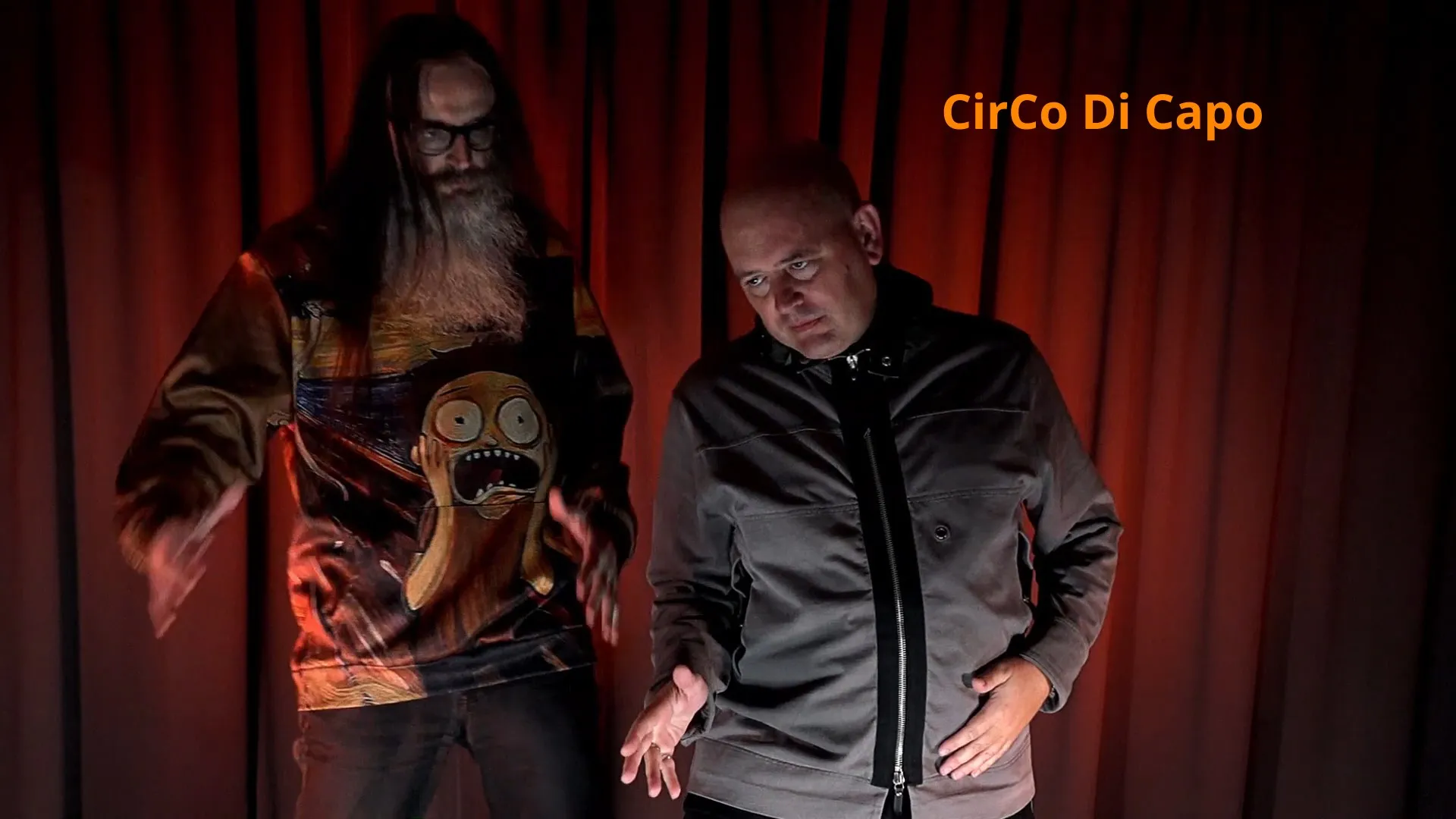 Dieter Provoost and Peter Capon of CirCo Di Capo on stage in front of a red curtain