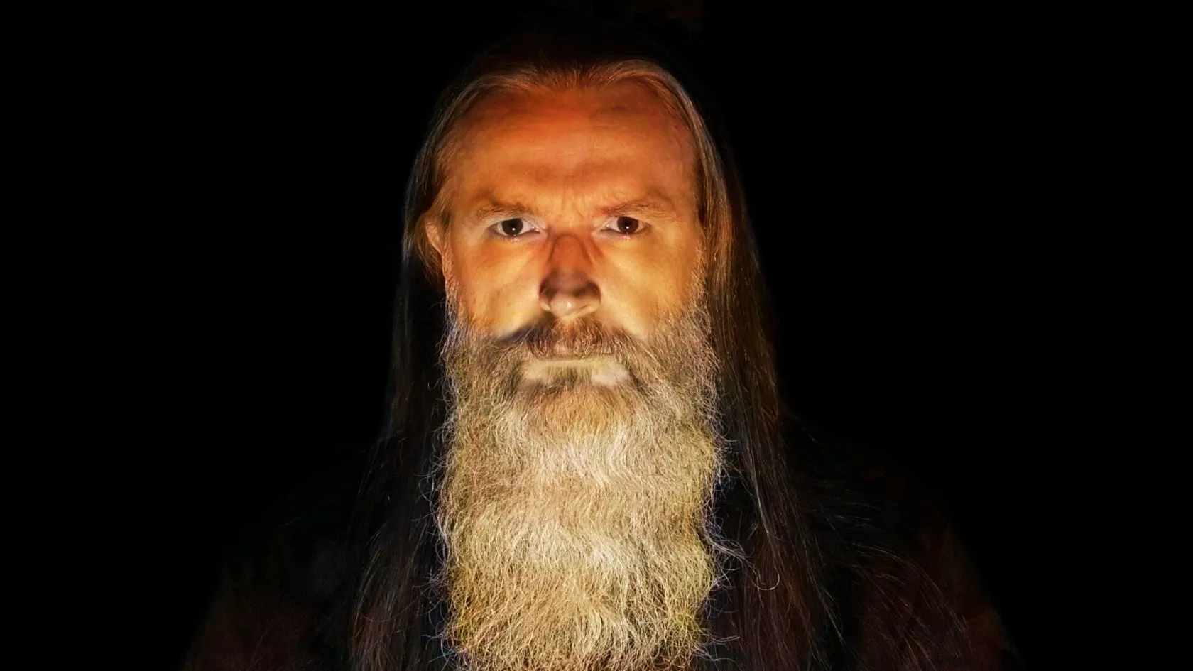 Portrait of Peter Capon with long grey beard