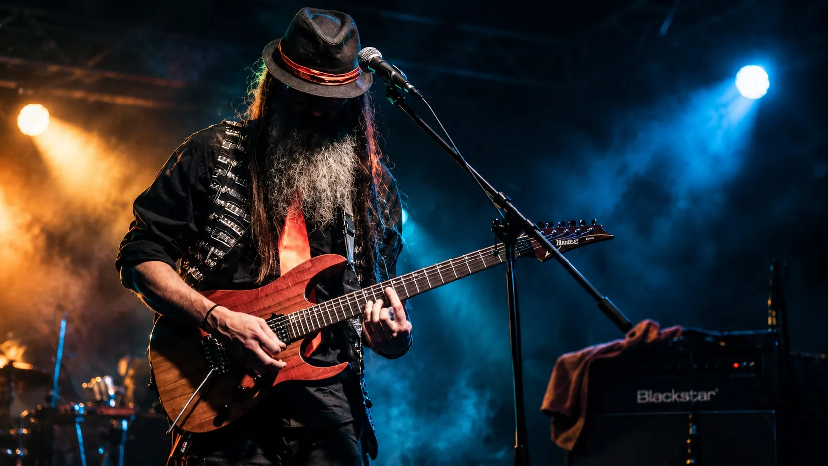 Peter Capon (CyCo) playing guitar live on stage